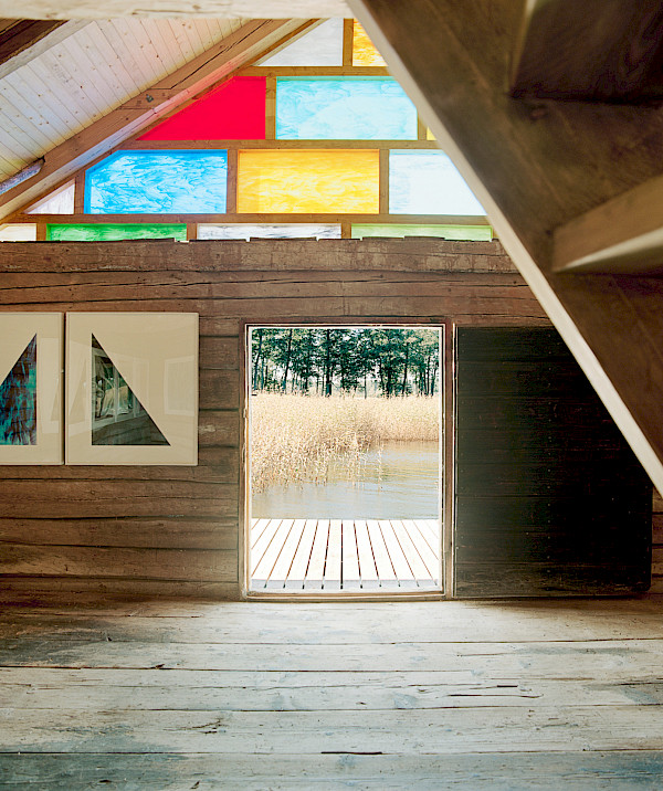 THE INTERIORS OF UNTITLED (BOAT HOUSE), BY SAM FALLS 2015. THE ARTIST ENHANCED AN EXISTING STRUCTURE, REPLACING THE WOODEN FACADE WITH A PATCHWORK OF STAINED GLASS PANELS